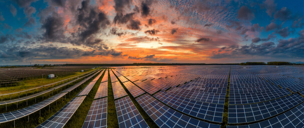 aerial view of solar power panels in clean energy generating station, solar energy farm, image by adobe stock