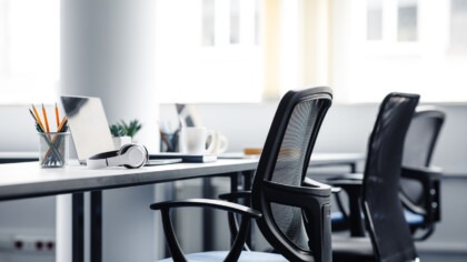 REturn to office, empty work space, office chair, image by Adobe stock